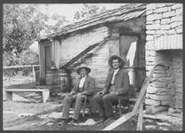 SA0088 - Napoleon Brown was an Elder. Brown and Daly are shown sitting outside by stone and wood buildings. Identified on the reverse., Winterthur Shaker Photograph and Post Card Collection 1851 to 1921c